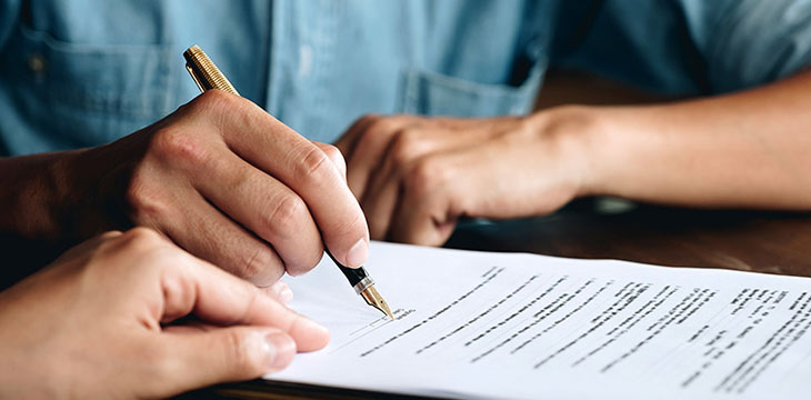 man about to sign a contract