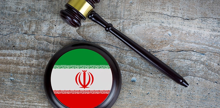 Wooden judgement or auction mallet with Iran flag.