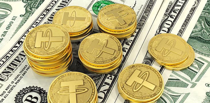 Tether. Cryptocurrency Gold coins. Cryptocurrency mining. Coins on the background of the dollar.