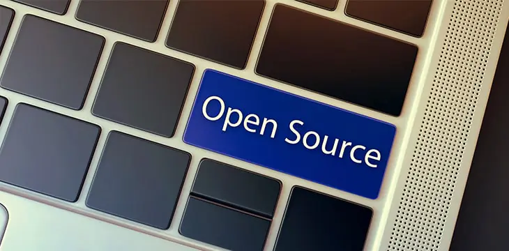 Open Source concept. Word imprinted on the keyboard key with blue color highlight.