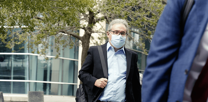 Ira Kleiman wearing mask in americana suit