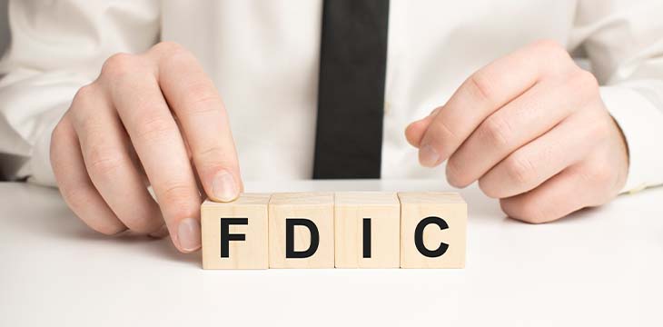 Man made word fdic with wood blocks