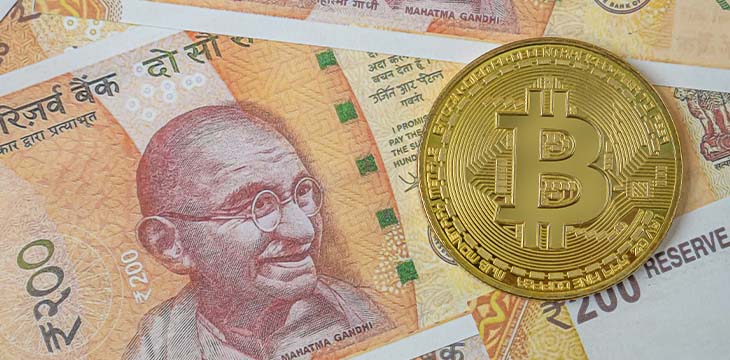 The India banknote and bit coin for business content.