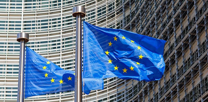 European Union flags in front of European Commission in Brussels, Belgium .