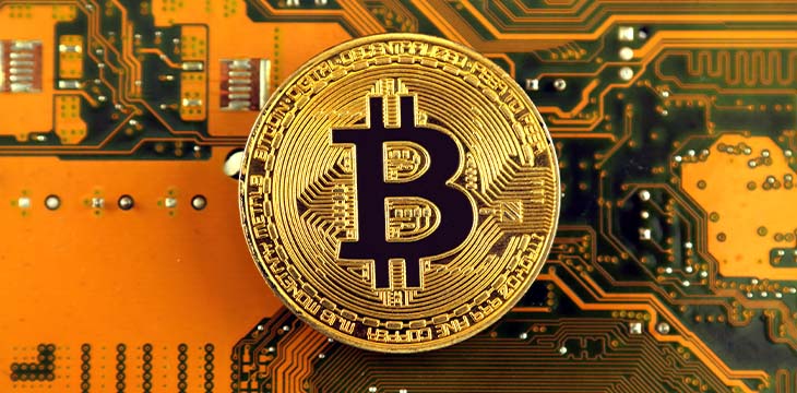 Bitcoin on a Motherboard Technology. Hi-tech concept background