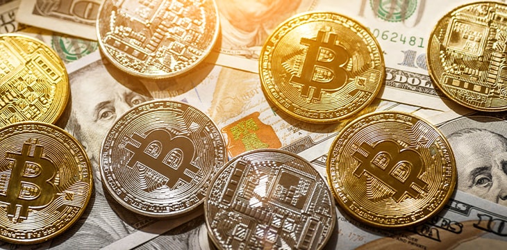 Golden Bitcoin lies on the banknotes