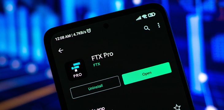 FTX logo on phone screen stock image