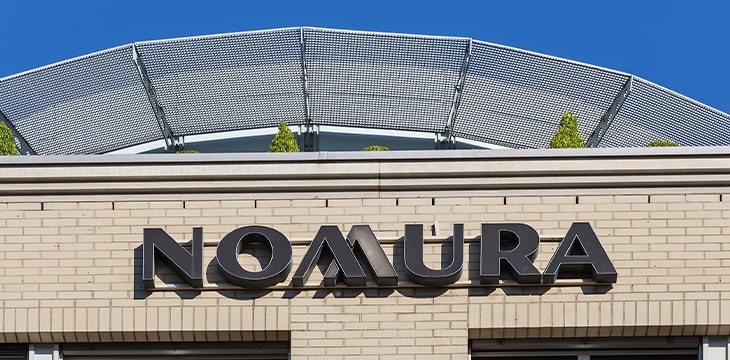 A building with the signage of Nomura