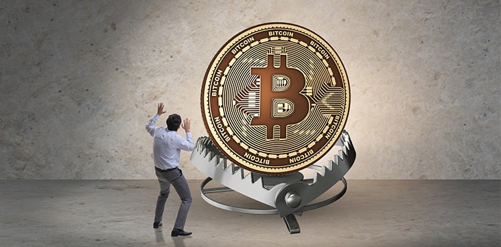 Businessman falling into the trap of bitcoin crypto