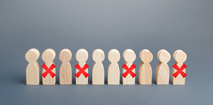 Row of wood symbolizing people with red X.