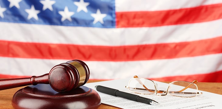 wooden gavel on american flag