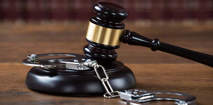 Mallet And Handcuffs On Table In Courtroom — Photo