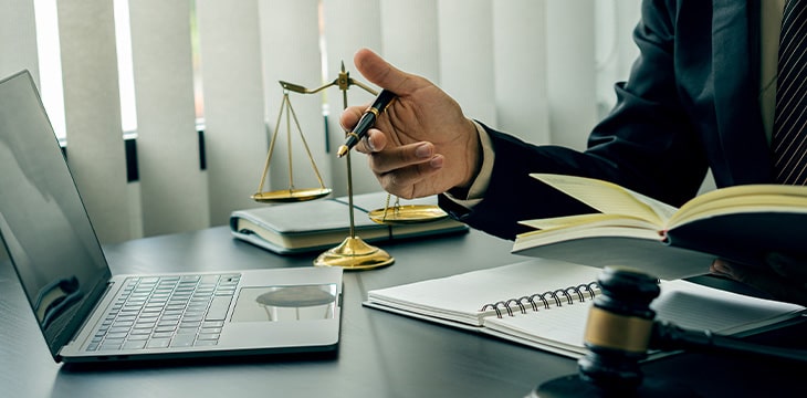 A male judge in the courtroom on a wooden table