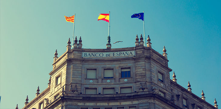 Bank of Spain building with flags