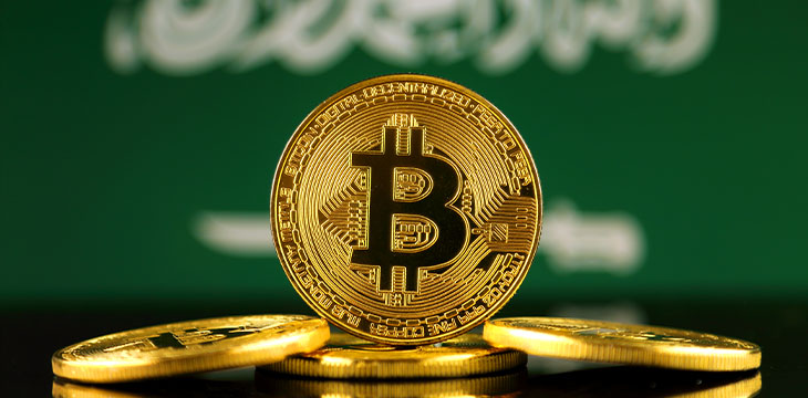 Physical version of Bitcoin over Saudi Arabia Flag