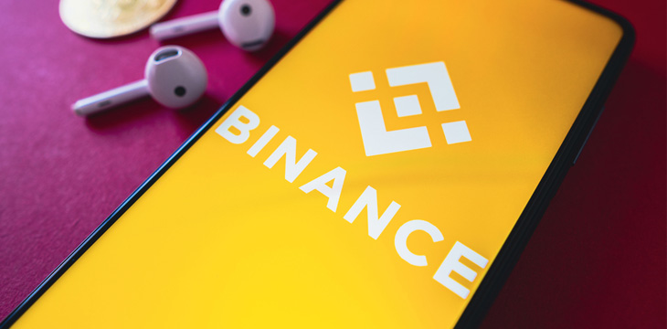 Binance logo on mobile phone