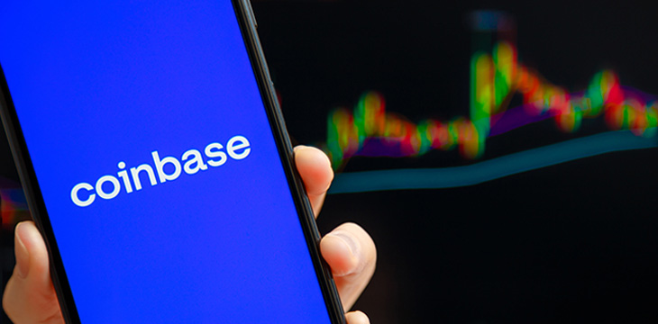 Coinbase mobile app running at smartphone screen with trading candlestick chart at background