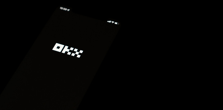 OKX logo on smartphone screen