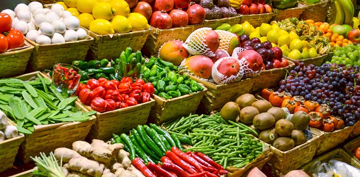 Fruit market with various colorful fresh fruits and vegetables