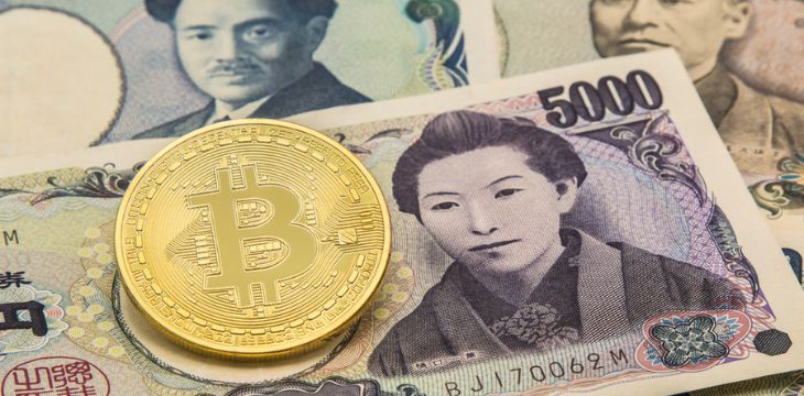 Golden Bitcoin on pile of many type japan banknotes background