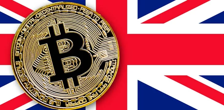 United Kingdom flag with gold bitcoin on top