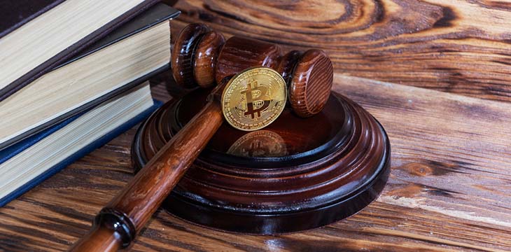 law gavel with gold bitcoin