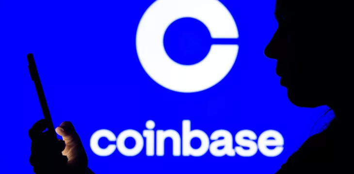 Coinbase logo and woman browsing on mobile phone