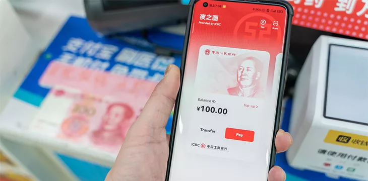 Chinese customer Using digital currency, the digital yuan on mobile phone when shopping in the mall