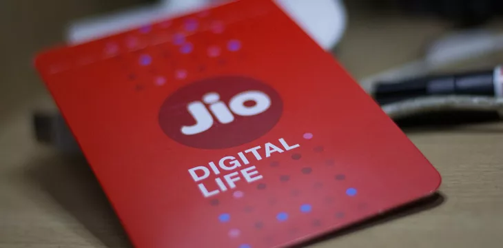 Close up photo of red Jio SIM card