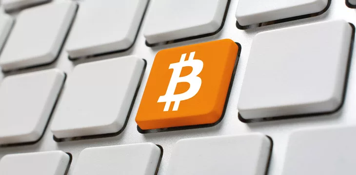 Bitcoin symbol on computer keyboard