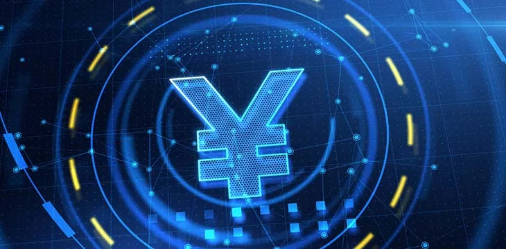 Digital Yuan symbol on blue technology background