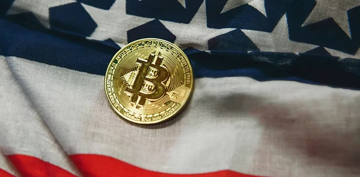 Close up shot of Bitcoin on American flag