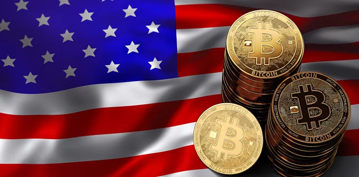 Stack of Bitcoin coins on USA flag