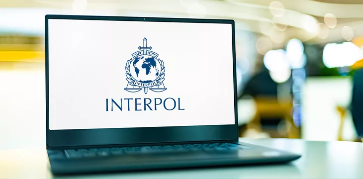 Interpol logo on a laptop