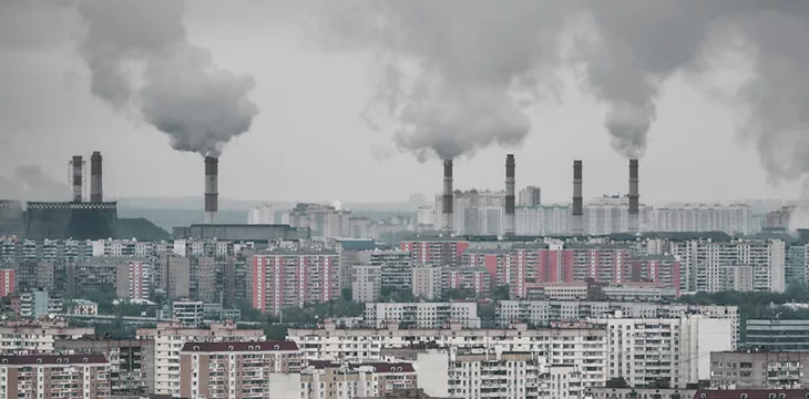 Multiple factory pipes producing coal smoke