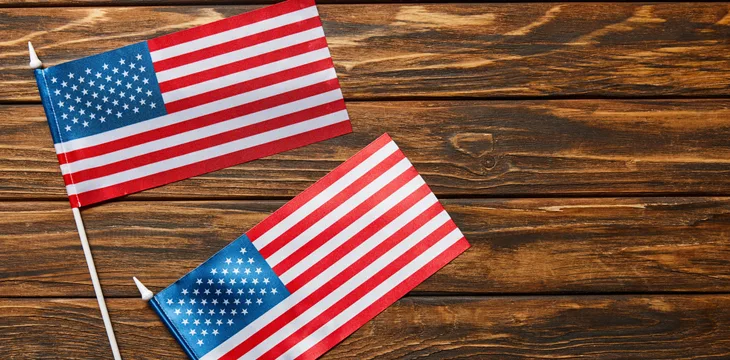 Top view of american flags on wooden surface