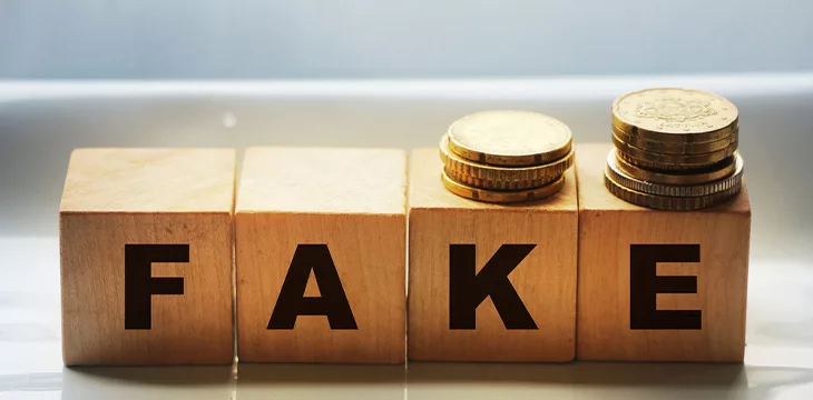 FAKE word written in wooden blocks