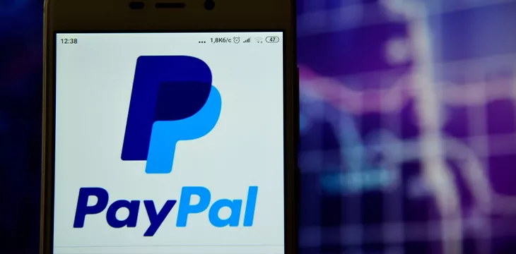 Paypal logo is seen on a smartphone