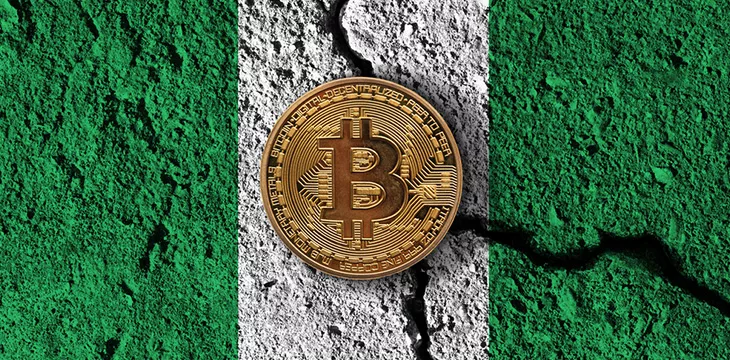 Digital coin with cracked Nigeria flag