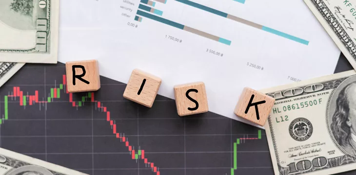 RISK word blocks on wooden table