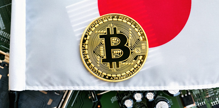 Gold coin with the national flag of Japan