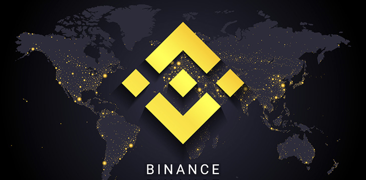 Binance logo with digital map